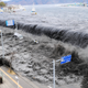 Tsunami floods over the breakwater protecting the coastal city of Miyako at Heigawa estuary area in northeastern Japan, on March 11, 2011.